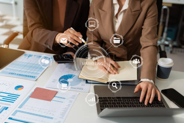 Digital marketing technology concept, Businessman use tablet and smartphone connection technology and digital marketing.